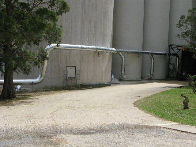 Insulated aeration piping along concrete silos